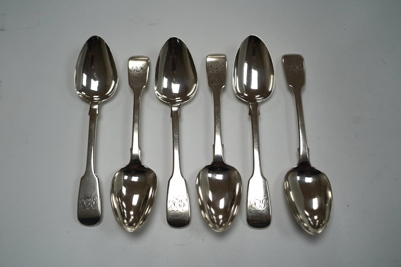 A set of six George IV silver fiddle pattern dessert spoons, John Hawkins, London, 1828, 16.7cm, 7oz. Condition - fair